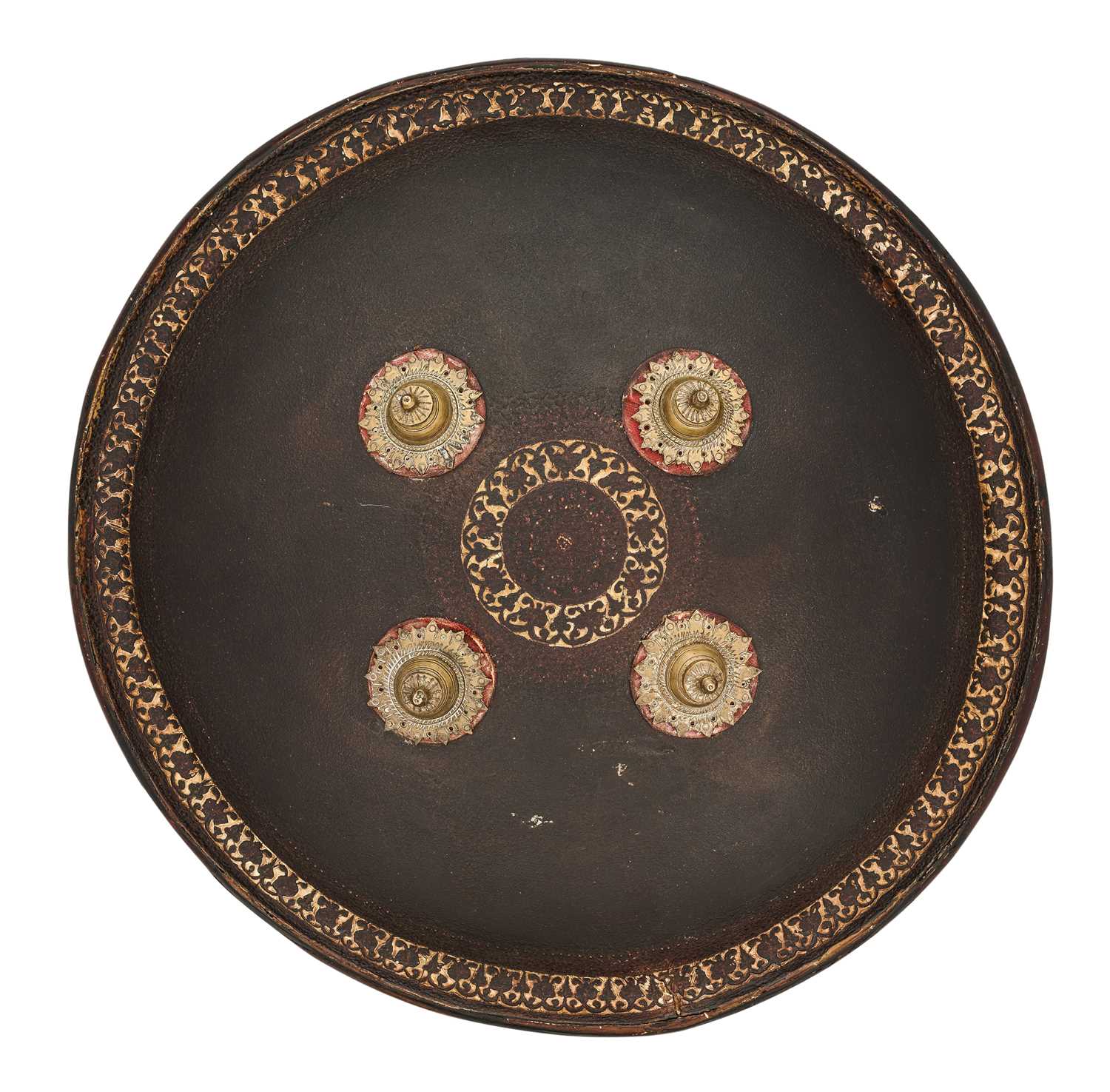 Lot 20 - AN INDIAN HIDE SHIELD (DHAL), 19TH CENTURY, SIGNED BHAGUAN KHOOSALOA, AHMEDABAD