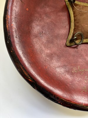 Lot 20 - AN INDIAN HIDE SHIELD (DHAL), 19TH CENTURY, SIGNED BHAGUAN KHOOSALOA, AHMEDABAD