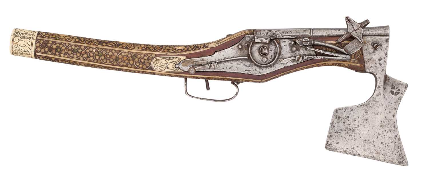 Lot 220 - A VERY RARE COMBINED SOUTH GERMAN 50 BORE WHEEL-LOCK PISTOL AND AXE, CIRCA 1580