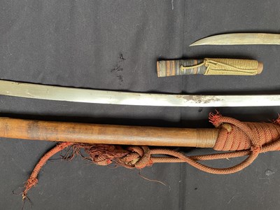 Lot 600 - A BURMESE SWORD (DHA) AND A SMALL DAGGER, LATE 19TH/20TH CENTURY