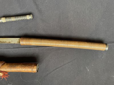 Lot 600 - A BURMESE SWORD (DHA) AND A SMALL DAGGER, LATE 19TH/20TH CENTURY