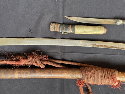 Lot 600 - A BURMESE SWORD (DHA) AND A SMALL DAGGER, LATE 19TH/20TH CENTURY