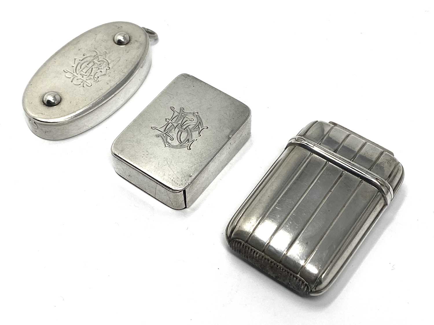 Lot 5 - THREE VICTORIAN SILVER VESTA CASES, EDWARD STOCKWELL, LONDON, 1869 / 74 / 87