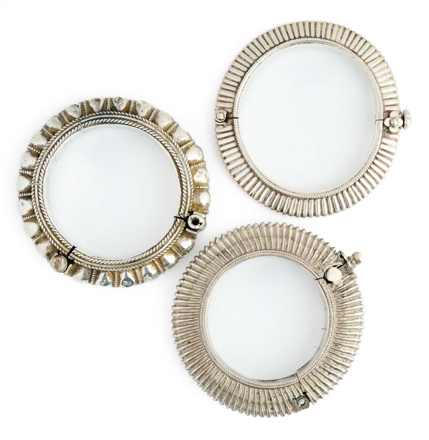 Lot 68 - THREE SILVER BRACELETS, INDIA, CIRCA 1900