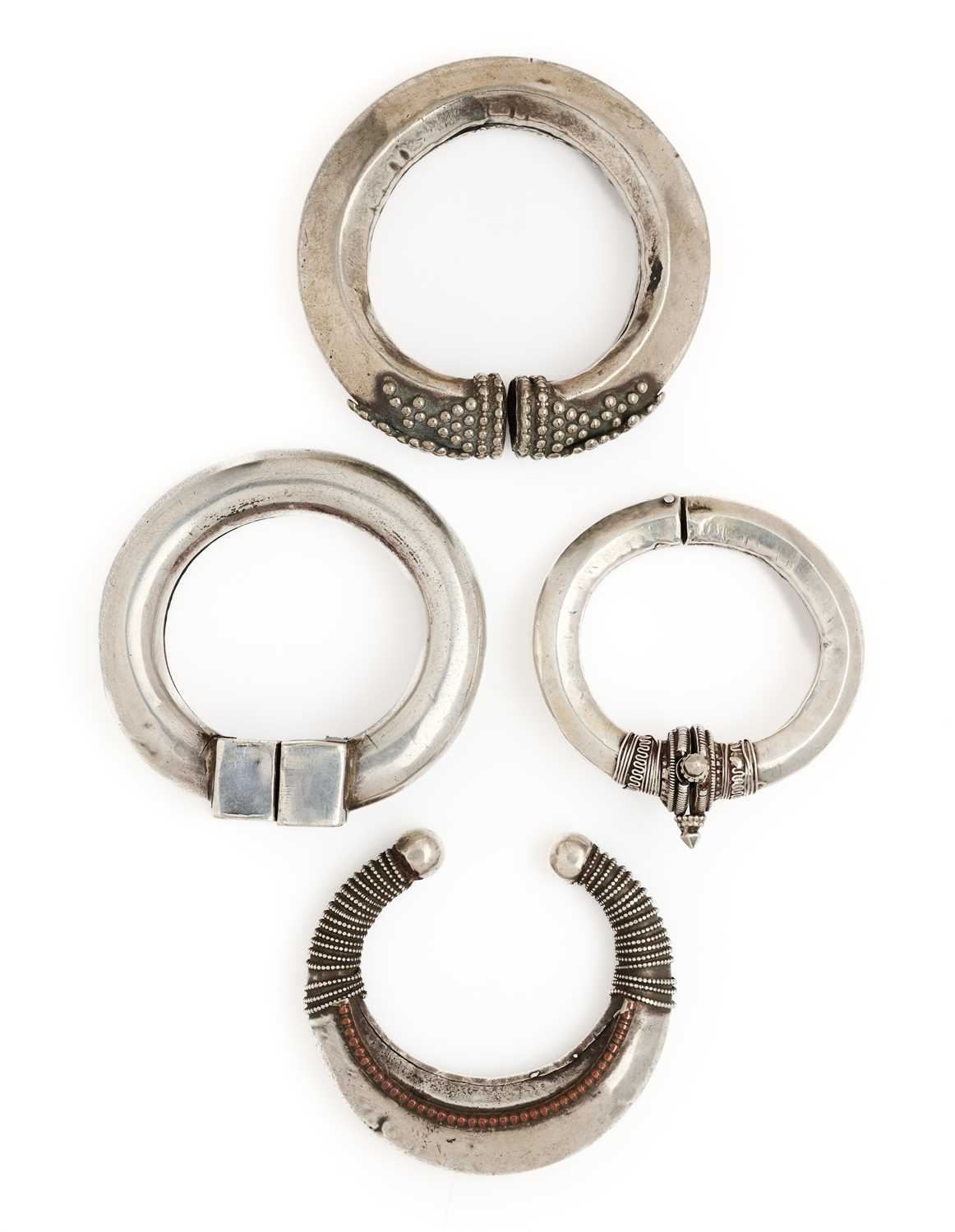 Lot 64 - FOUR SILVER BRACELETS, RAJASTHAN OR GUJARAT, INDIA, CIRCA 1900