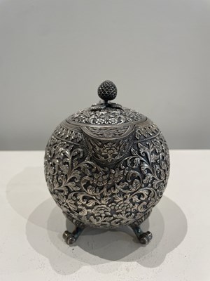 Lot 206 - A KUTCH SILVER TEASET, OOMERSI MAWJI OF BHUJ, WESTERN INDIA, 1880-1890