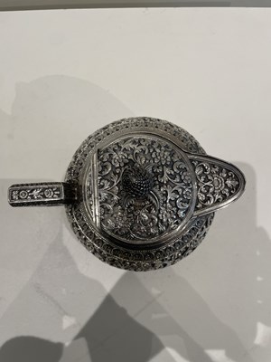 Lot 206 - A KUTCH SILVER TEASET, OOMERSI MAWJI OF BHUJ, WESTERN INDIA, 1880-1890