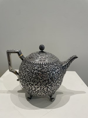 Lot 206 - A KUTCH SILVER TEASET, OOMERSI MAWJI OF BHUJ, WESTERN INDIA, 1880-1890