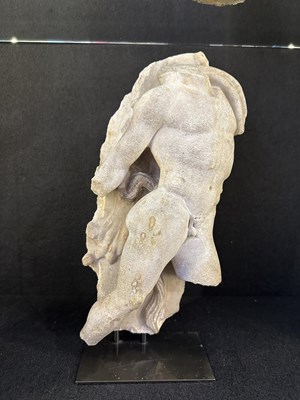 Lot 80 - A ROMAN MARBLE RELIEF FRAGMENT DEPICTING A DANCING SATYR, 2ND/3RD CENTURY A.D.