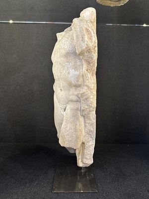 Lot 80 - A ROMAN MARBLE RELIEF FRAGMENT DEPICTING A DANCING SATYR, 2ND/3RD CENTURY A.D.