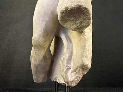 Lot 80 - A ROMAN MARBLE RELIEF FRAGMENT DEPICTING A DANCING SATYR, 2ND/3RD CENTURY A.D.