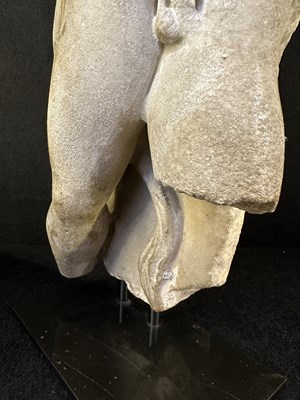 Lot 80 - A ROMAN MARBLE RELIEF FRAGMENT DEPICTING A DANCING SATYR, 2ND/3RD CENTURY A.D.