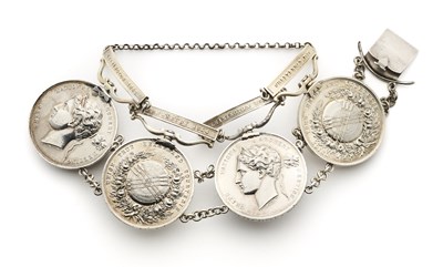 Lot 62 - FOUR GRAND NATIONAL ARCHERY MEETING MEDALS FORMED AS A SILVER BRACELET, 1852-83
