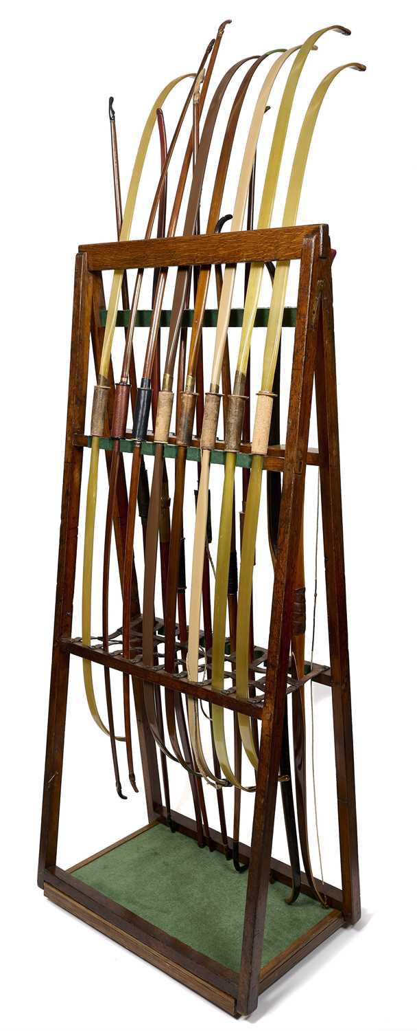 Lot 69 - A FOLDING CONTINENTAL ARCHERY STAND WITH SIXTEEN CONTINENTAL BOWS, EARLY 20TH CENTURY
