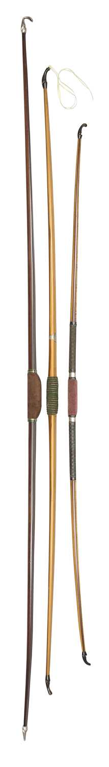 Lot 82 - AN EARLY LAMINATED BOW AND TWO PRESENTATION LONGBOWS, 19TH/20TH CENTURY