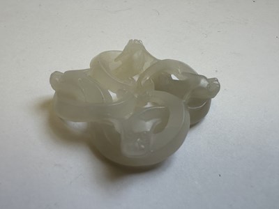 Lot 78 - A CHINESE WHITE JADE 'CHILONG' PENDANT, QING DYNASTY (1644-1911)