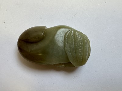 Lot 76 - A CHINESE CARVED CELADON AND RUSSET JADE CAT FISH, QING DYNASTY (1644-1911)