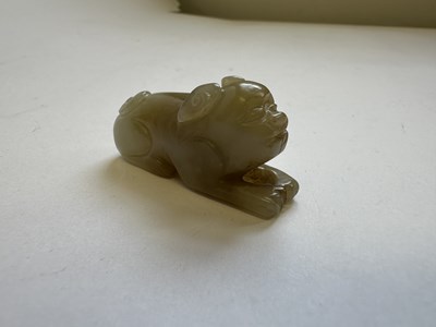 Lot 64 - A CHINESE CARVED JADE HOUND, QING DYNASTY (1644-1911)