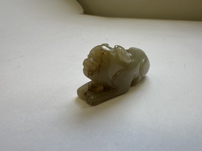 Lot 64 - A CHINESE CARVED JADE HOUND, QING DYNASTY (1644-1911)