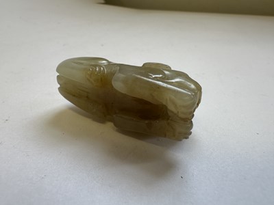 Lot 64 - A CHINESE CARVED JADE HOUND, QING DYNASTY (1644-1911)