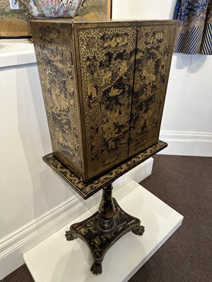 Lot 32 - A GOOD CHINESE EXPORT GILT DECORATED BLACK LACQUER COLLECTOR'S CABINET ON STAND, CIRCA 1815