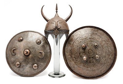 Lot 561 - AN INDIAN HELMET (TOP) AND TWO INDIAN SHIELDS (DHAL), 19TH CENTURY AND LATER