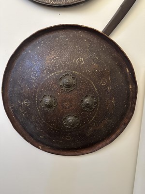 Lot 565 - THREE INDIAN HIDE SHIELDS (DHAL), 19TH CENTURY