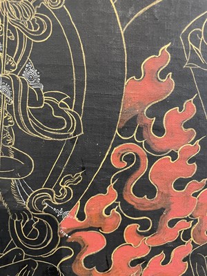 Lot 156 - A BLACK GROUND THANG-KA DEPICTING MAHAKALA, TIBET, 18TH/19TH CENTURY