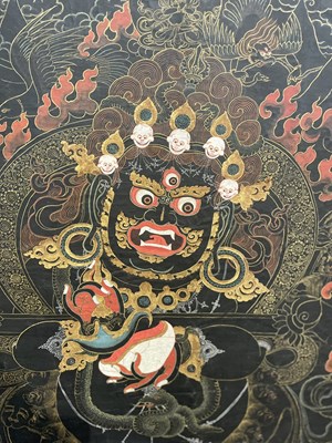 Lot 156 - A BLACK GROUND THANG-KA DEPICTING MAHAKALA, TIBET, 18TH/19TH CENTURY