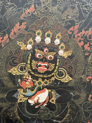 Lot 156 - A BLACK GROUND THANG-KA DEPICTING MAHAKALA, TIBET, 18TH/19TH CENTURY
