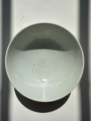 Lot 5 - A CHINESE CELADON-GLAZED 'LOTUS' BOWL, YONGZHENG MARK AND POSSIBLY OF THE PERIOD