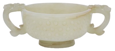 Lot 253 - A CHINESE CELADON JADE ARCHAISTIC CUP