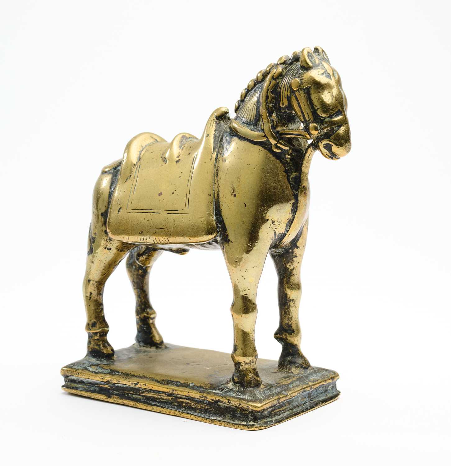 Lot 33 - A BRASS FIGURE OF A HORSE, WESTERN DECCAN, INDIA, 17TH/18TH CENTURY