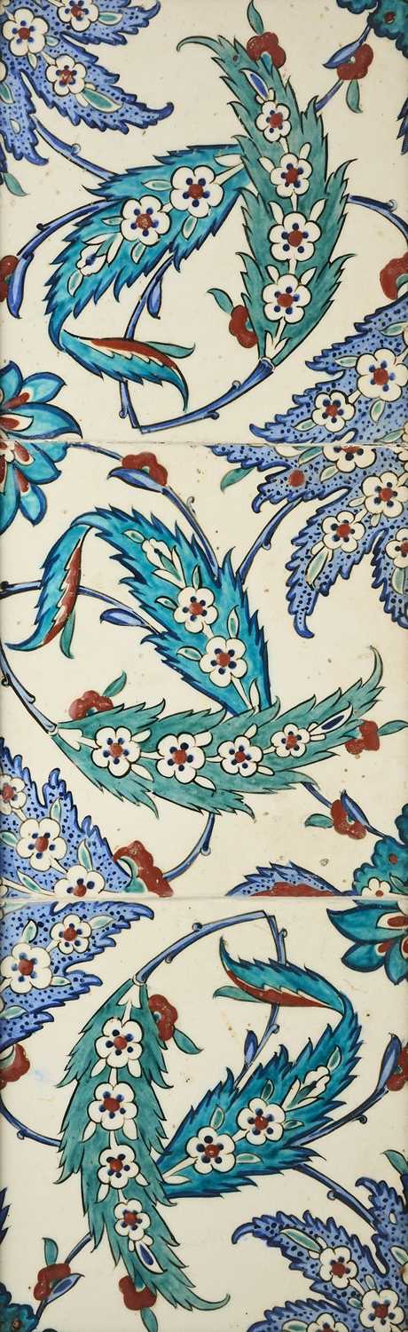 Lot 112 - AN IZNIK PANEL OF THREE TILES, OTTOMAN ANATOLIA, CIRCA 1600