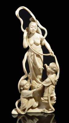 Lot 264 - ~A JAPANESE IVORY OKIMONO OF AN ANGEL AND TWO CHILDREN