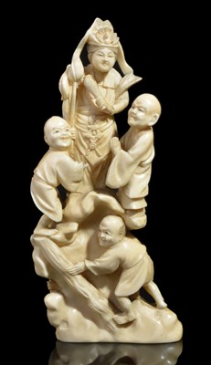 Lot 267 - ~A JAPANESE WALRUS IVORY OKIMONO OF KANNON AND WORSHIPPERS