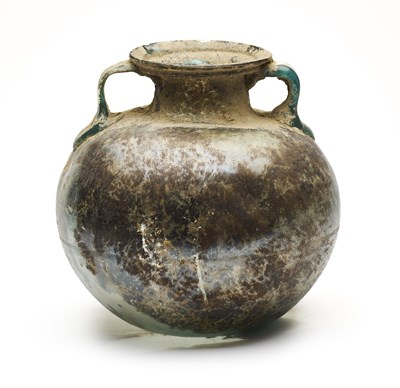 Lot 45 - A ROMAN BLUE GLASS SPHERICAL BODIED CINERARY URN, CIRCA 2ND-3RD CENTURY A.D.