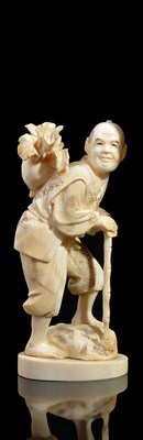 Lot 269 - ~A JAPANESE IVORY OKIMONO OF A FARMER