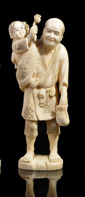 Lot 270 - ~A JAPANESE IVORY OKIMONO OF A FARMER AND SON