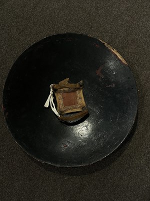 Lot 128 - AN HIDE SHIELD (DHAL), NORTHERN INDIA, 19TH CENTURY