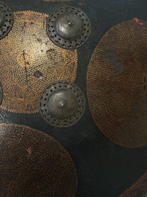Lot 128 - AN HIDE SHIELD (DHAL), NORTHERN INDIA, 19TH CENTURY