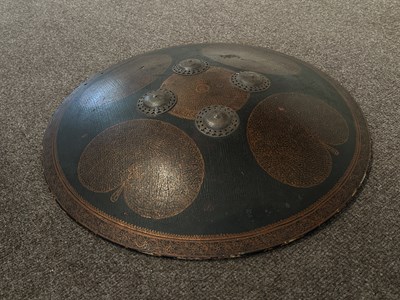 Lot 128 - AN HIDE SHIELD (DHAL), NORTHERN INDIA, 19TH CENTURY