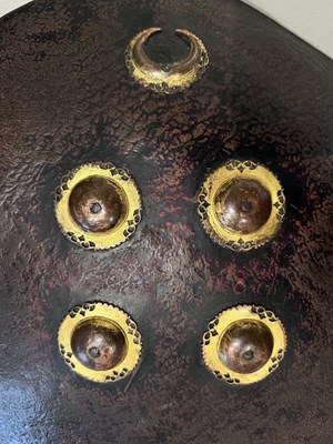 Lot 129 - A HIDE SHIELD (DHAL), NORTHERN INDIA, 18TH CENTURY