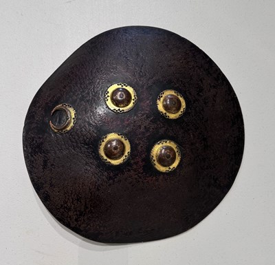 Lot 129 - A HIDE SHIELD (DHAL), NORTHERN INDIA, 18TH CENTURY
