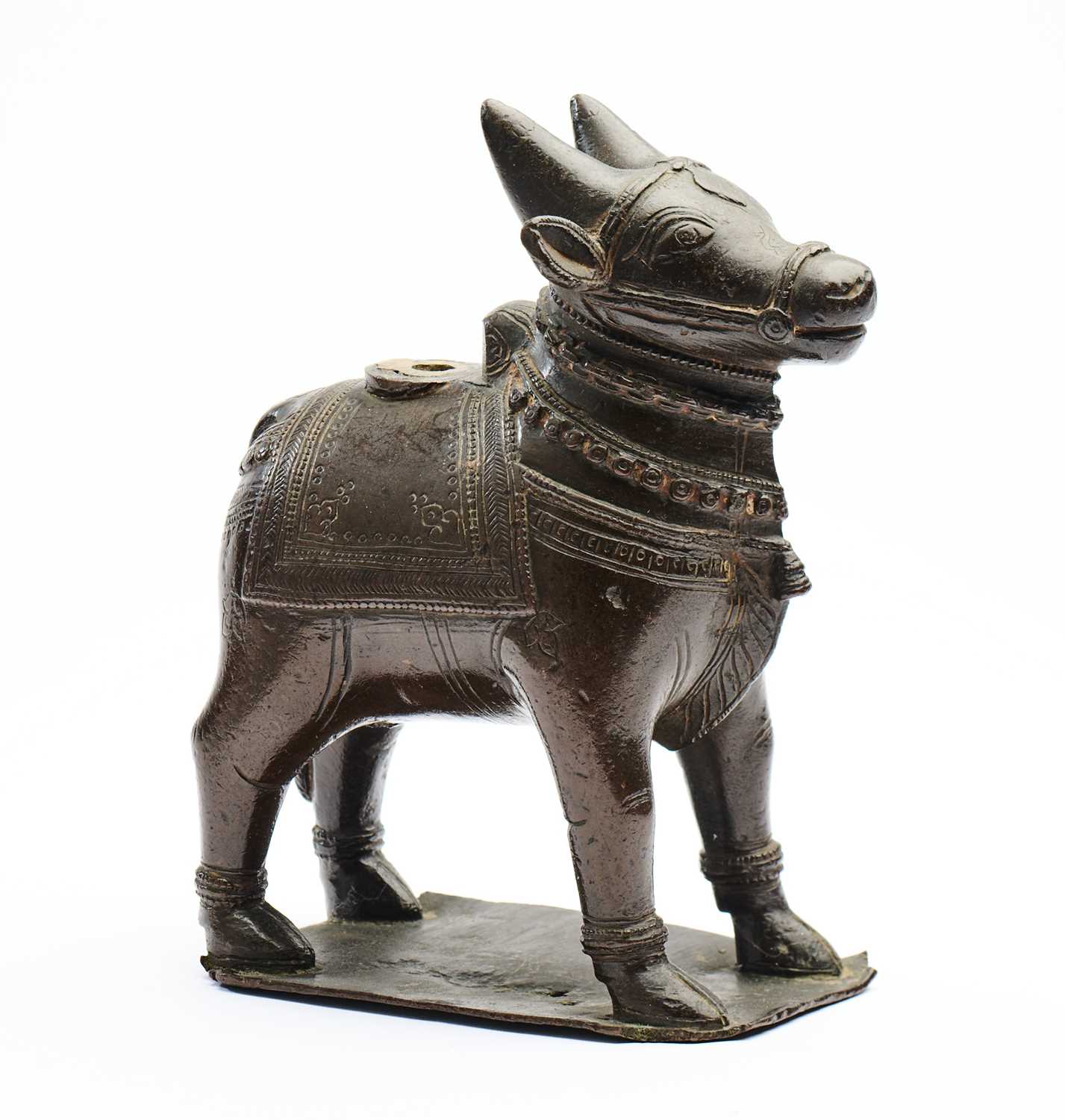 Lot 34 - A BRONZE FIGURE OF NANDI BULL, TAMIL NADU, SOUTH INDIA, 18TH/19TH CENTURY