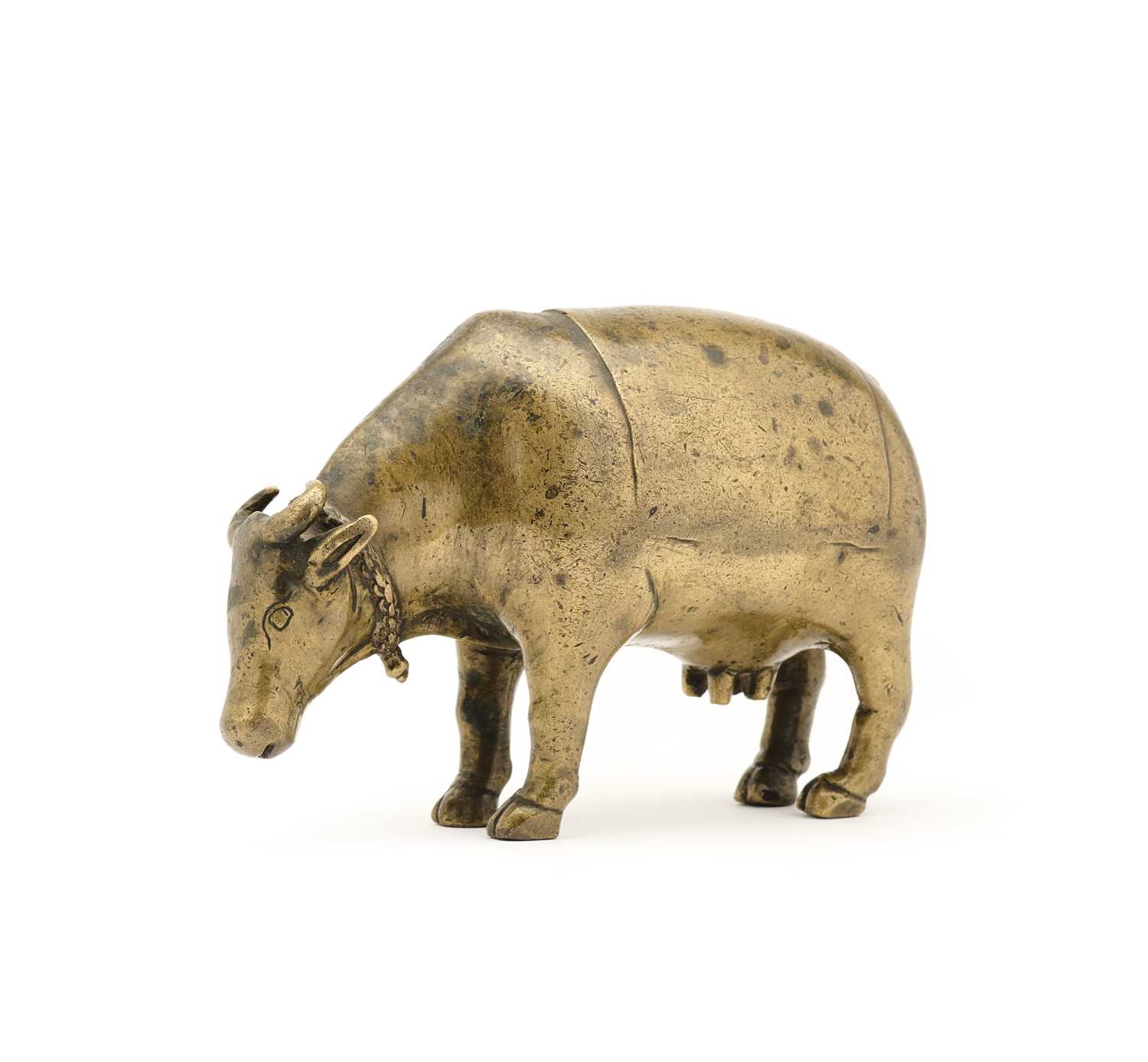 Lot 191 - A BRONZE RITUAL SPRINKLER IN THE FORM OF A COW, INDIA, CIRCA 17TH CENTURY