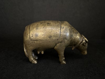 Lot 191 - A BRONZE RITUAL SPRINKLER IN THE FORM OF A COW, INDIA, CIRCA 17TH CENTURY