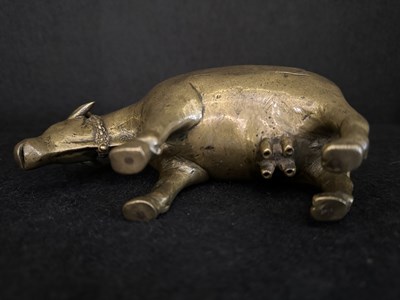 Lot 191 - A BRONZE RITUAL SPRINKLER IN THE FORM OF A COW, INDIA, CIRCA 17TH CENTURY