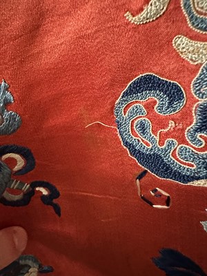 Lot 56 - A CHINESE WOMAN'S SILK EMBROIDERED RED-GROUND ROBE, CHANGYI, QING DYNASTY, LATER 19TH CENTURY