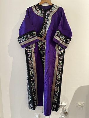 Lot 55 - A CHINESE WOMAN'S SILK EMBROIDERED PURPLE-GROUND ROBE, CHANGYI, QING DYNASTY, LATER 19TH CENTURY